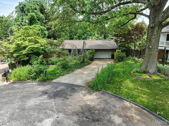 3 Cardigan Ln, Saint Louis, MO 63135 - view of front of property with driveway and a garage