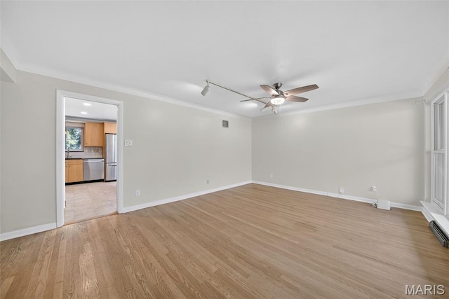 3 Cardigan Ln, Saint Louis, MO 63135 - spare room featuring a ceiling fan, light wood-style flooring, and crown molding