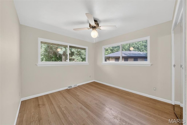 3 Cardigan Ln, Saint Louis, MO 63135 - empty room with wood finished floors and a ceiling fan