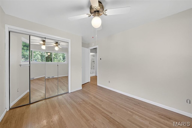 3 Cardigan Ln, Saint Louis, MO 63135 - unfurnished bedroom featuring wood finished floors, a closet, and a ceiling fan