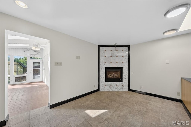 3 Cardigan Ln, Saint Louis, MO 63135 - unfurnished living room featuring a fireplace and ceiling fan