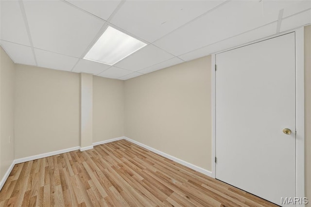 3 Cardigan Ln, Saint Louis, MO 63135 - finished below grade area with light wood-type flooring and a paneled ceiling