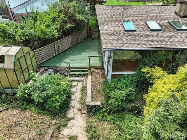 3 Cardigan Ln, Saint Louis, MO 63135 - view of tennis court featuring a greenhouse and an outdoor structure