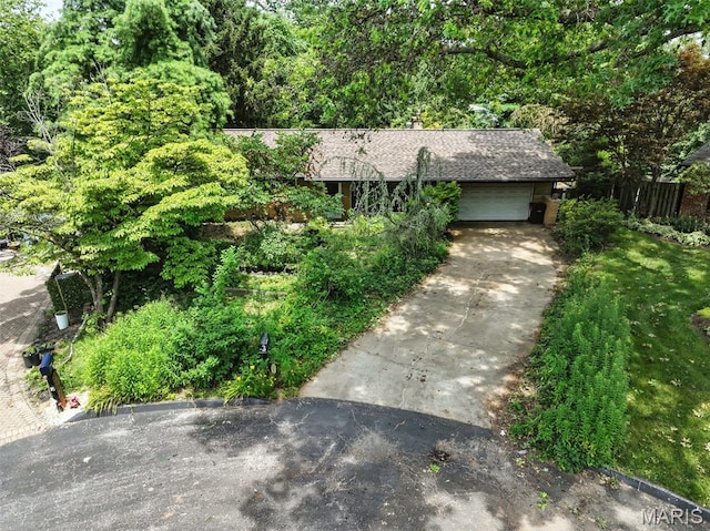 3 Cardigan Ln, Saint Louis, MO 63135 - view of front of property with an attached garage and driveway