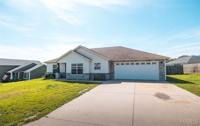111 Brush Creek Pkwy, Saint Robert, MO 65584 - ranch-style house with stone siding, an attached garage, and concrete driveway