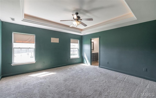 111 Brush Creek Pkwy, Saint Robert, MO 65584 - carpeted spare room with a tray ceiling and a ceiling fan