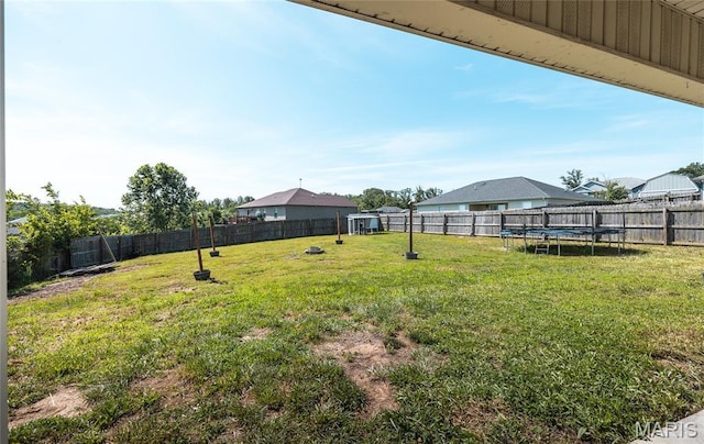 111 Brush Creek Pkwy, Saint Robert, MO 65584 - fenced backyard featuring a trampoline