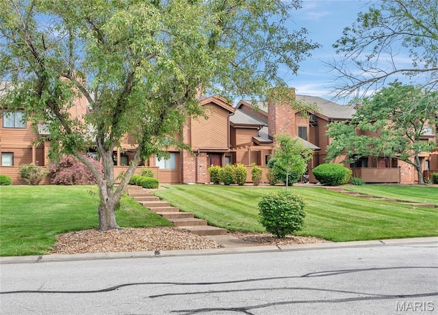 225 Hemingway Ln Unit F, Weldon Spring, MO 63304 - view of front of home featuring brick siding and a front yard