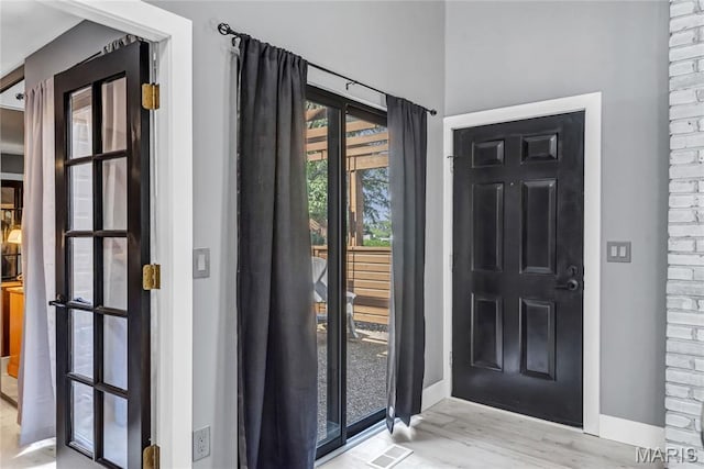 225 Hemingway Ln Unit F, Weldon Spring, MO 63304 - entrance foyer with baseboards and wood finished floors