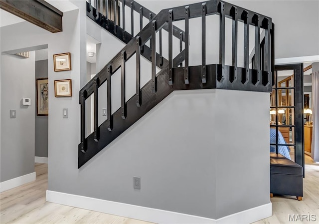 225 Hemingway Ln Unit F, Weldon Spring, MO 63304 - stairs featuring wood finished floors and a towering ceiling