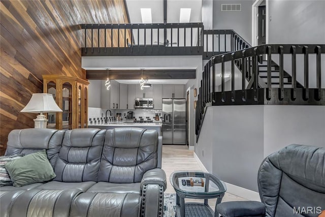 225 Hemingway Ln Unit F, Weldon Spring, MO 63304 - living area with a high ceiling and stairs