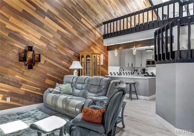 225 Hemingway Ln Unit F, Weldon Spring, MO 63304 - living area featuring wood walls and a towering ceiling