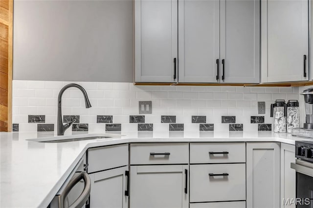225 Hemingway Ln Unit F, Weldon Spring, MO 63304 - kitchen with decorative backsplash, light countertops, and stainless steel appliances