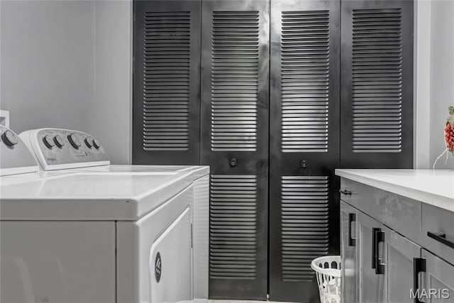 225 Hemingway Ln Unit F, Weldon Spring, MO 63304 - laundry area featuring cabinet space and independent washer and dryer