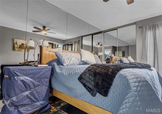 225 Hemingway Ln Unit F, Weldon Spring, MO 63304 - bedroom with a textured ceiling and a ceiling fan