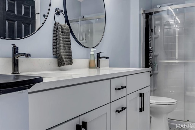 225 Hemingway Ln Unit F, Weldon Spring, MO 63304 - bathroom featuring double vanity and a stall shower