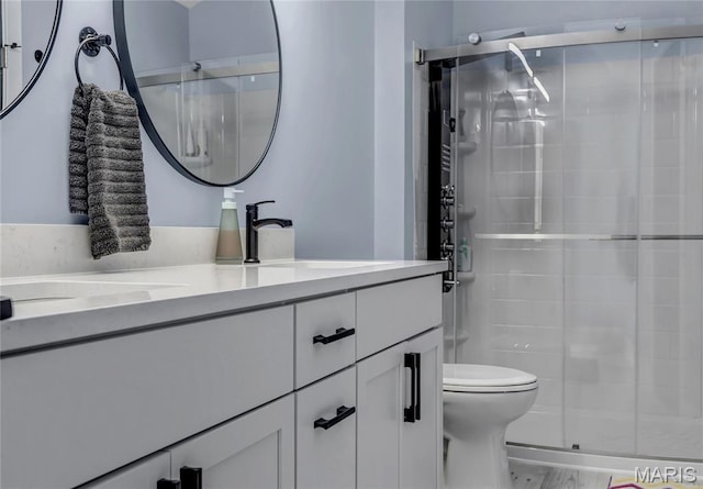 225 Hemingway Ln Unit F, Weldon Spring, MO 63304 - bathroom featuring vanity, a stall shower, and marble finish flooring