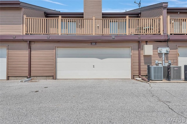 225 Hemingway Ln Unit F, Weldon Spring, MO 63304 - garage with asphalt driveway