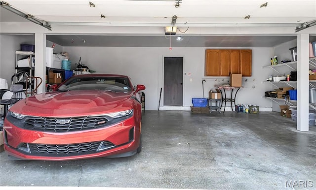 225 Hemingway Ln Unit F, Weldon Spring, MO 63304 - garage featuring a garage door opener
