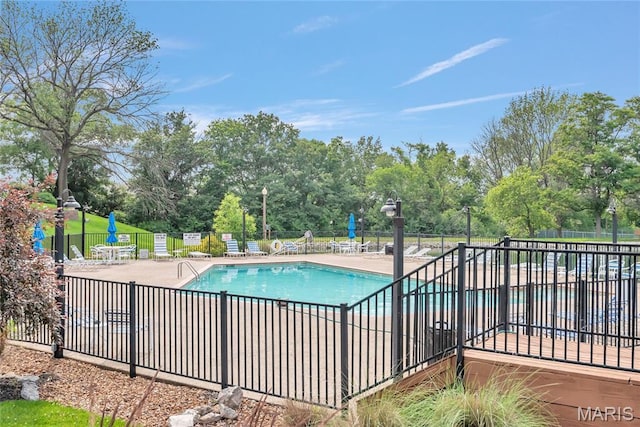 225 Hemingway Ln Unit F, Weldon Spring, MO 63304 - community pool with view of scattered trees and a patio area
