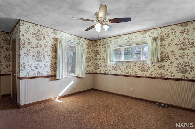 4831 S State Route 159, Glen Carbon, IL 62034 - empty room featuring a wainscoted wall and ceiling fan