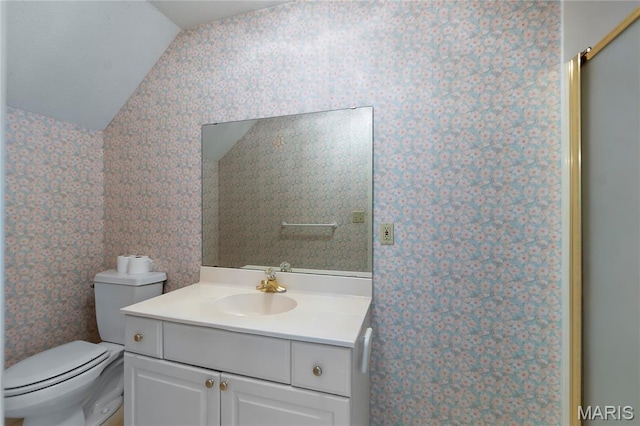 2615 Saddle Ridge Ln, Cape Girardeau, MO 63701 - bathroom with vaulted ceiling, wallpapered walls, vanity, and a shower