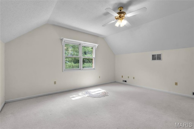 2615 Saddle Ridge Ln, Cape Girardeau, MO 63701 - additional living space featuring vaulted ceiling, carpet, a ceiling fan, and a textured ceiling