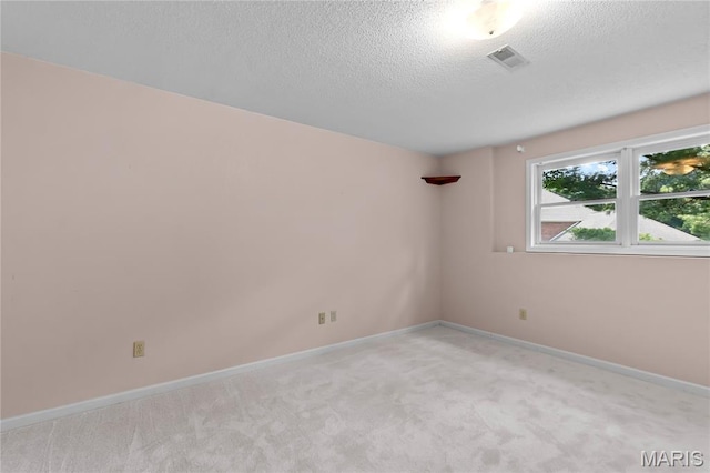 2615 Saddle Ridge Ln, Cape Girardeau, MO 63701 - spare room with light colored carpet and a textured ceiling