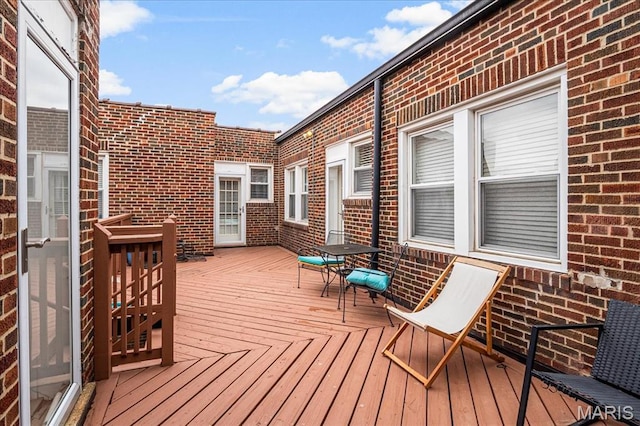 7570 Byron Pl Unit 3W, Saint Louis, MO 63105 - wooden deck featuring outdoor dining space