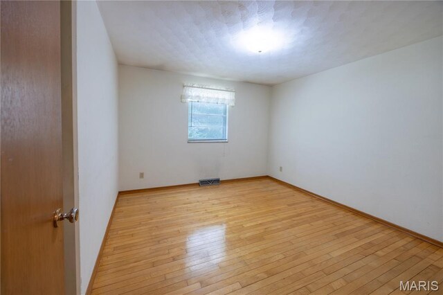 1131 Kimbel Ln, Jackson, MO 63755 - empty room featuring light wood-style floors and baseboards