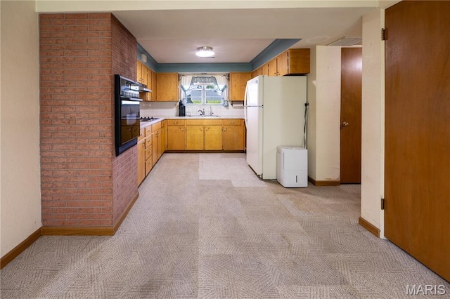 1131 Kimbel Ln, Jackson, MO 63755 - kitchen featuring freestanding refrigerator, light countertops, light carpet, and oven