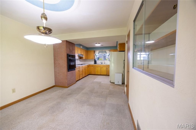 1131 Kimbel Ln, Jackson, MO 63755 - kitchen with white appliances, under cabinet range hood, light colored carpet, and light countertops