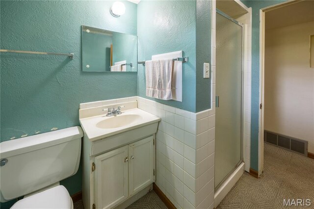 1131 Kimbel Ln, Jackson, MO 63755 - bathroom with vanity, a shower stall, and a textured wall
