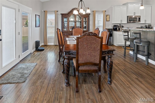 2626 Waldon Ln, Belleville, IL 62221 - dining space with healthy amount of natural light, a chandelier, and dark wood-style flooring