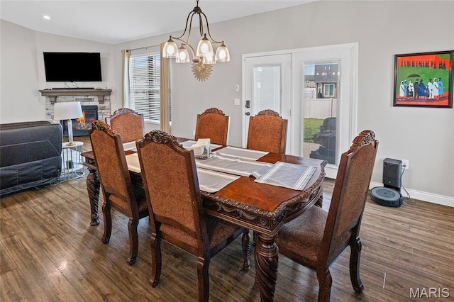 2626 Waldon Ln, Belleville, IL 62221 - dining room with wood finished floors, a chandelier, a fireplace, and vaulted ceiling