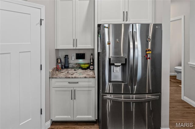 2626 Waldon Ln, Belleville, IL 62221 - kitchen featuring stainless steel fridge, dark wood-style floors, white cabinets, and light stone countertops
