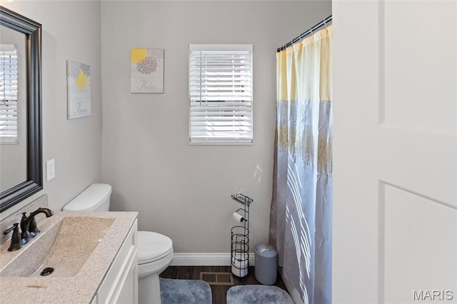 2626 Waldon Ln, Belleville, IL 62221 - bathroom with vanity, wood finished floors, and a shower with curtain