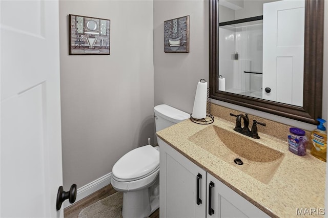 2626 Waldon Ln, Belleville, IL 62221 - bathroom featuring vanity, wood finished floors, and a shower