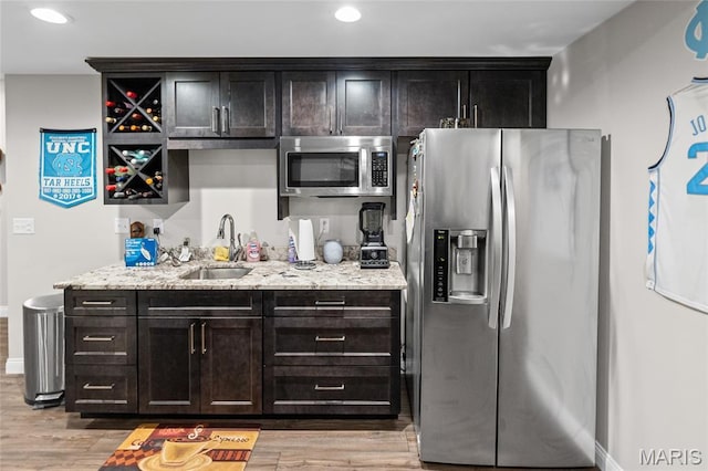 2626 Waldon Ln, Belleville, IL 62221 - kitchen featuring stainless steel appliances, light wood-type flooring, light stone countertops, and recessed lighting