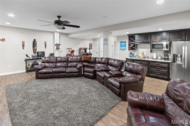 2626 Waldon Ln, Belleville, IL 62221 - living area featuring wet bar, light wood-type flooring, recessed lighting, and a ceiling fan
