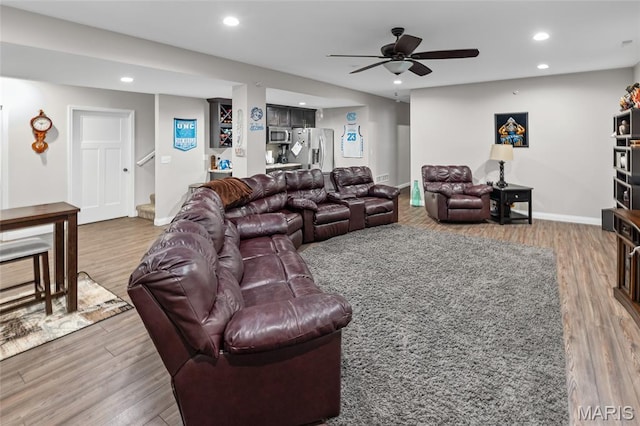 2626 Waldon Ln, Belleville, IL 62221 - living room featuring wood finished floors, recessed lighting, ceiling fan, and stairs