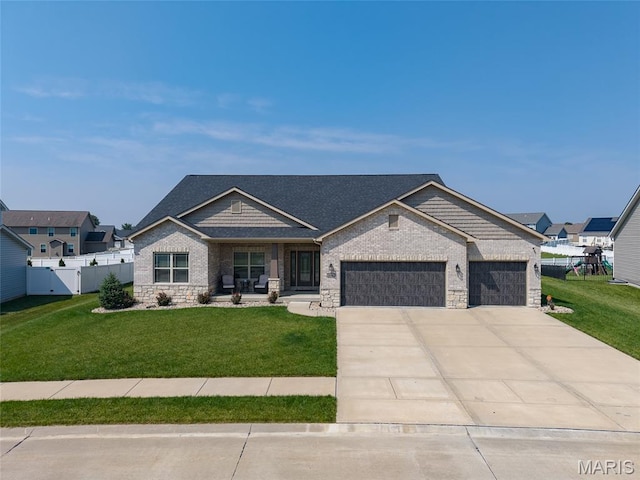 2626 Waldon Ln, Belleville, IL 62221 - craftsman house featuring a garage, driveway, and stone siding