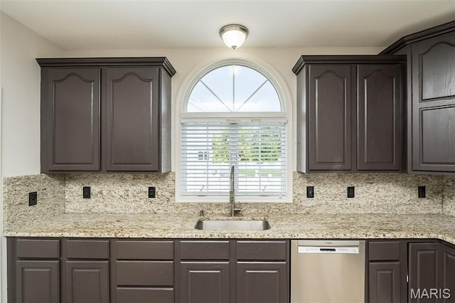 86 Homefield Square Ct, Ofallon, MO 63366 - kitchen featuring stainless steel dishwasher, backsplash, dark brown cabinetry, and light stone countertops