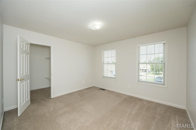 86 Homefield Square Ct, Ofallon, MO 63366 - spare room featuring light colored carpet and baseboards