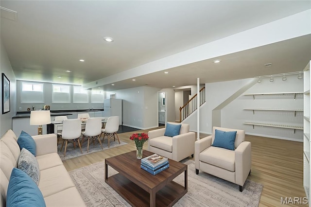 86 Homefield Square Ct, Ofallon, MO 63366 - living room with light wood-style floors, stairway, and recessed lighting