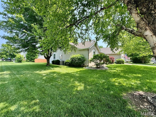 829 Clemson Ave, Fairview Heights, IL 62208 - view of side of property with a yard and roof with shingles