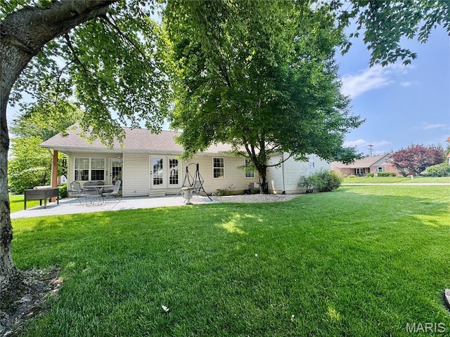 829 Clemson Ave, Fairview Heights, IL 62208 - rear view of property featuring a lawn and a patio area