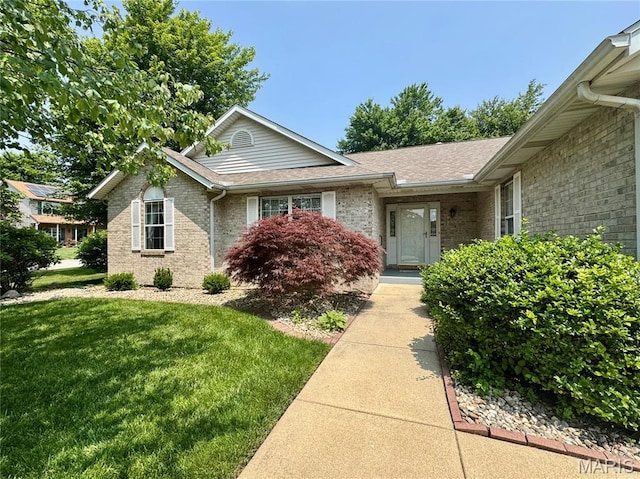 829 Clemson Ave, Fairview Heights, IL 62208 - view of front facade with brick siding, a front lawn, and a shingled roof