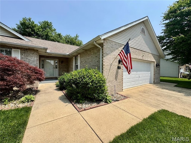 829 Clemson Ave, Fairview Heights, IL 62208 - view of front facade featuring brick siding, concrete driveway, and an attached garage