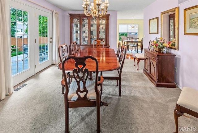829 Clemson Ave, Fairview Heights, IL 62208 - dining space featuring a chandelier and light colored carpet